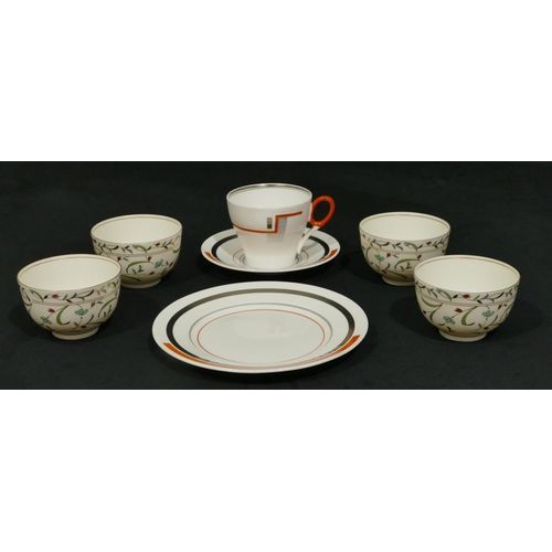 61 - A Shelley china trio on white, orange and grey ground, comprising of cup, saucer and side plate, 4 t... 