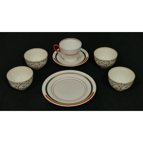 61 - A Shelley china trio on white, orange and grey ground, comprising of cup, saucer and side plate, 4 t... 