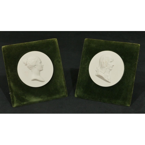 64 - 2 Sevres blanc de chine circular plaques with raised figurehead of gentleman and lady, mounted on gr... 