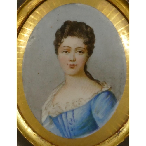 65 - An oval porcelain plaque shoulder length portrait of a lady in fruitwood frame (plaque 8.5cm x 7cm)