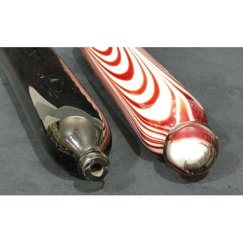 66 - A clear and ruby glass rolling pin, 37cm long, a 19th Century brown glass rolling pin, 35cm long (2)