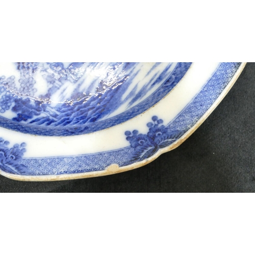 67 - An octagonal blue and white plate, depicting Oriental figures on riverbank with animal (chipped), 25... 