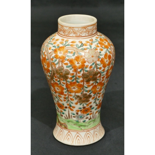 68 - An Oriental round bulbous thin necked vase on white ground with red, green tree, floral and gilt dec... 