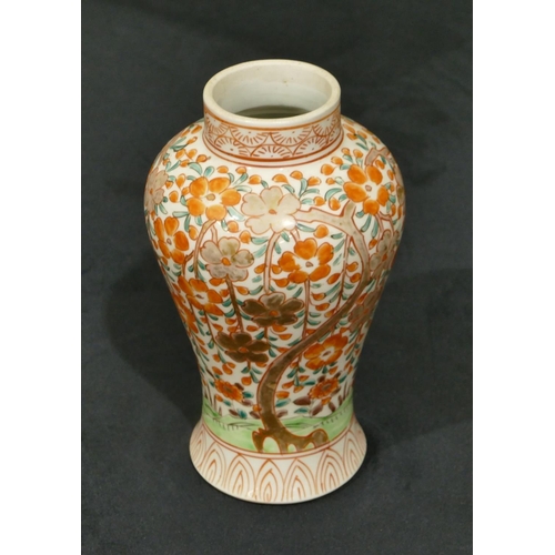 68 - An Oriental round bulbous thin necked vase on white ground with red, green tree, floral and gilt dec... 