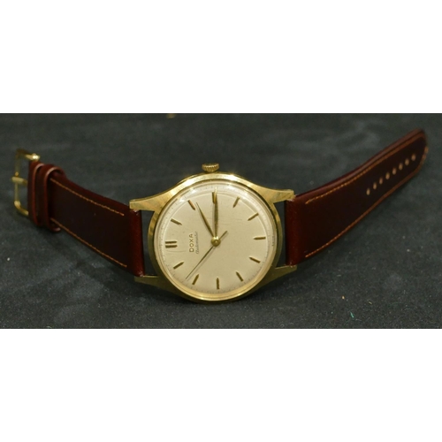 690 - A 14ct gold Doxa automatic gentleman's circular wristwatch with modern leather strap (working)