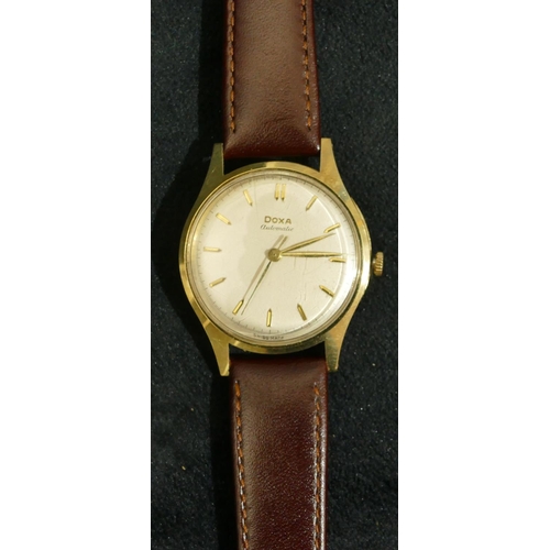 690 - A 14ct gold Doxa automatic gentleman's circular wristwatch with modern leather strap (working)