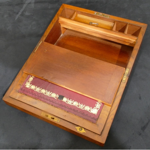 702 - A 19th Century walnut rectangular shaped writing box with brass mounts, hinged lid enclosing red lea... 