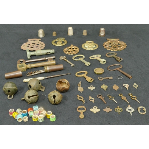 714 - 5 Crotal bells and a quantity of various bird rings, thimbles, keys etc.