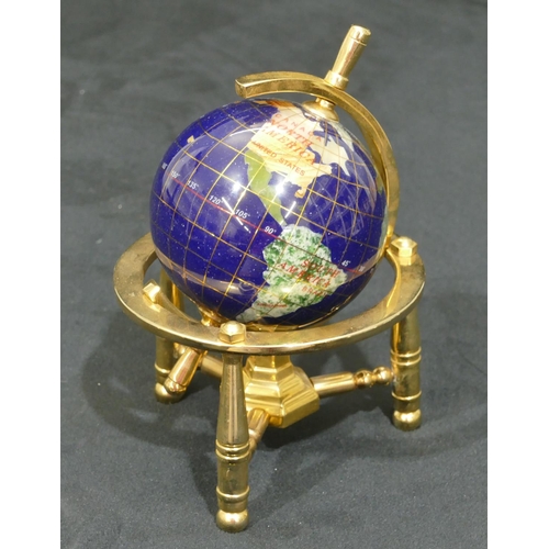 732 - A miniature gilt metal table top globe on turned leg, 15.5cm high