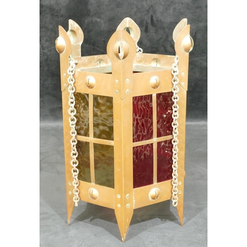 734 - An Arts and Crafts copper hexagonal shaped lantern with yellow and red glass panels, 35cm high witho... 