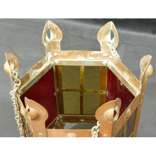 734 - An Arts and Crafts copper hexagonal shaped lantern with yellow and red glass panels, 35cm high witho... 