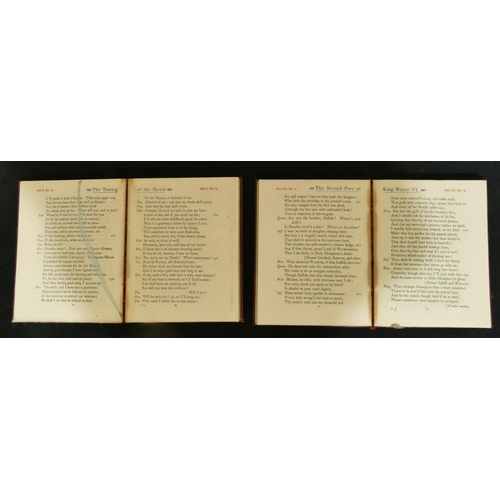 738 - A collection of red leather bound Shakespeare books, all mounted in ebonised table top cabinet