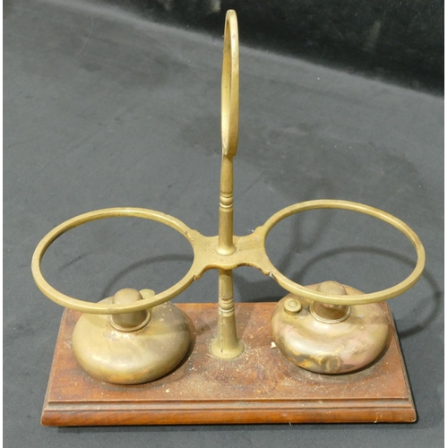 745 - Robertson & Co, Glasgow brass double bottle burner stand with centre carrying handle, 2 burners on m... 