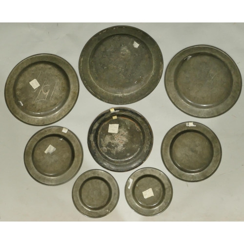 746 - An 18th Century pewter charger, 34.5cm diameter, a pair of pewter chargers, 30.5cm diameter, a pair ... 