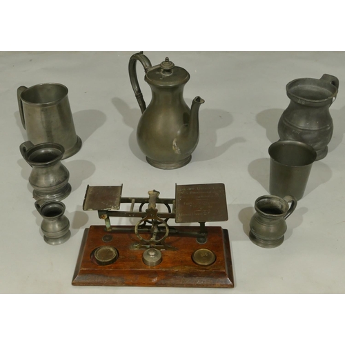 748 - A set of brass balance scales on mahogany rectangular shaped base with 3 odd weights, a pewter round... 