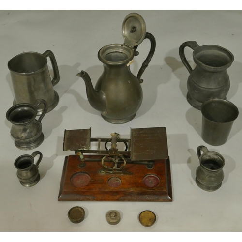 748 - A set of brass balance scales on mahogany rectangular shaped base with 3 odd weights, a pewter round... 