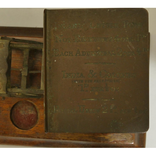 748 - A set of brass balance scales on mahogany rectangular shaped base with 3 odd weights, a pewter round... 