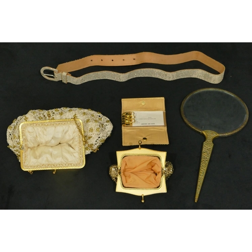 750 - A brass handled hand mirror, 3 evening purses and 1 belt (5)