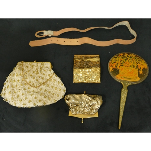 750 - A brass handled hand mirror, 3 evening purses and 1 belt (5)