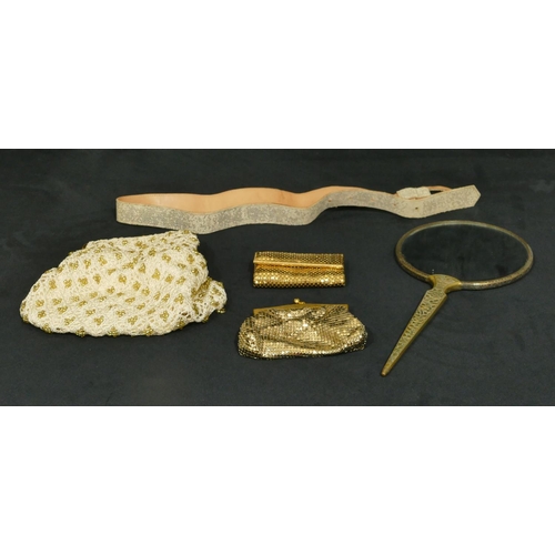 750 - A brass handled hand mirror, 3 evening purses and 1 belt (5)