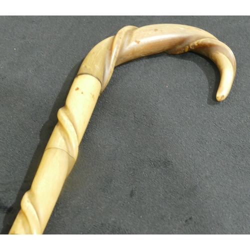 753 - A horn walking stick with raised entwined decoration, another walking stick with horn handle, 7 othe... 