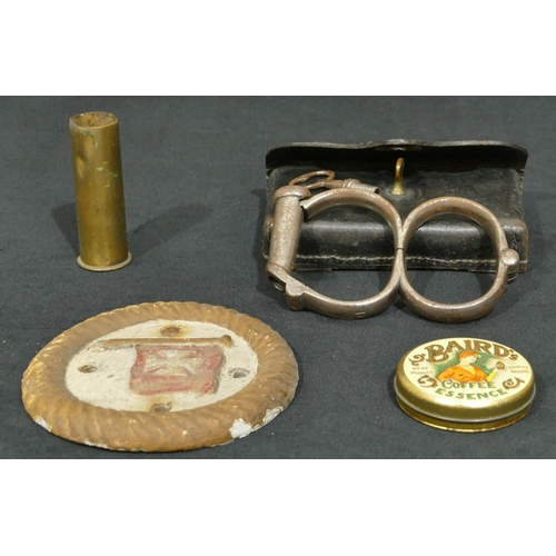 763 - A pair of W Cowen 19th Century handcuffs with key in fitted leather case, a metal circular plaque an... 