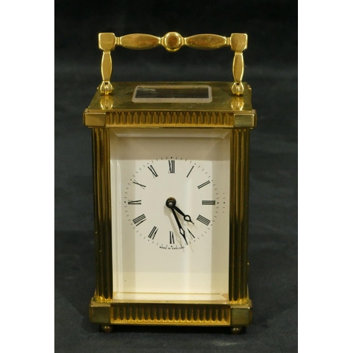 810 - Lionel Peck, London brass carriage clock with white enamel dial, Roman numerals, swing overhead hand... 