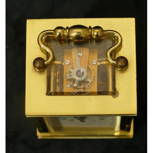 811 - Lionel Peck, London miniature brass carriage clock with white enamel dial, Roman numerals, swing ove... 