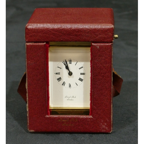 811 - Lionel Peck, London miniature brass carriage clock with white enamel dial, Roman numerals, swing ove... 