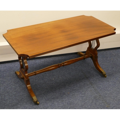 819 - A mahogany rectangular shaped coffee table with concaved reeded corners, inlaid stringing on lyre en... 