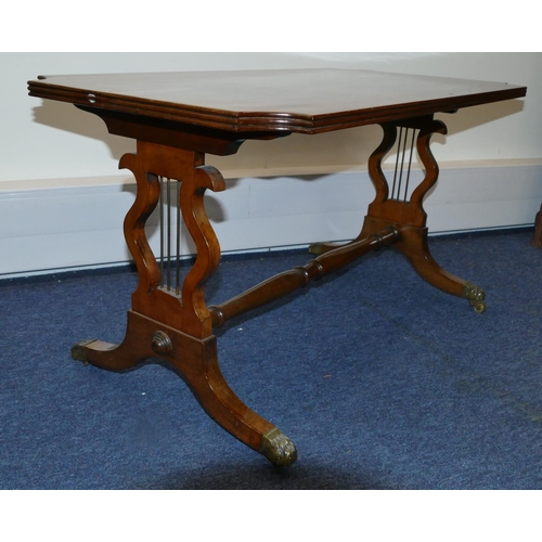 819 - A mahogany rectangular shaped coffee table with concaved reeded corners, inlaid stringing on lyre en... 