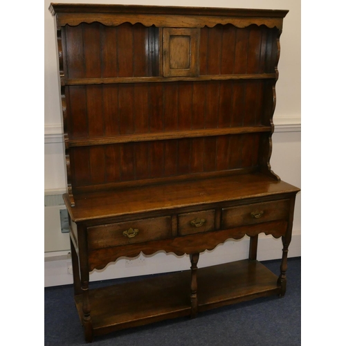 829 - A quality reproduction oak Welsh dresser with shelved back with single panelled door, 3 drawers belo... 