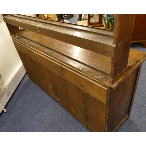 835 - A Georgian oak Welsh dresser with open shelf back, 3 drawers above single panel, flanked by 2 panel ... 