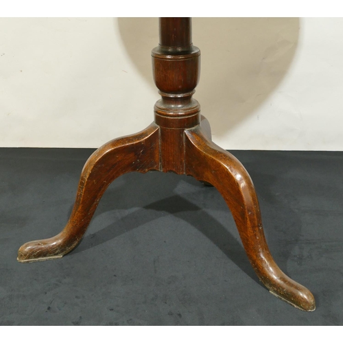 843 - A 19th Century oak round tilt top occasional table on gun barrel stem with 3 splayed legs, 78cm diam... 