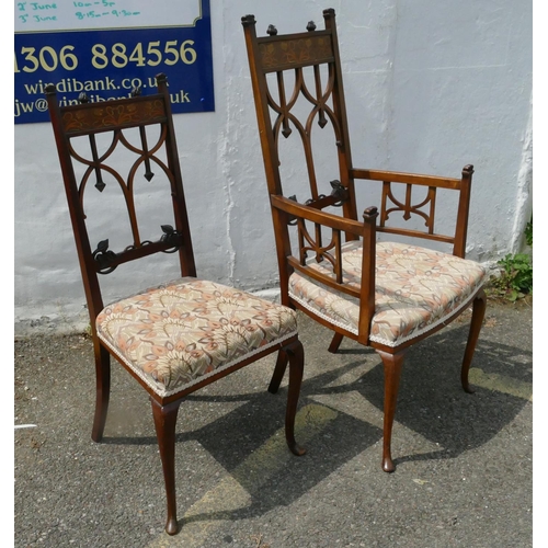 850 - An Edwardian mahogany Arts and Crafts style carving chair with inlaid floral and scroll decoration, ... 