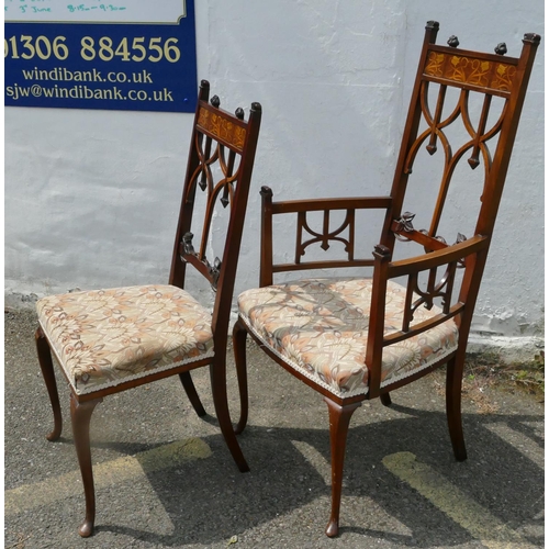 850 - An Edwardian mahogany Arts and Crafts style carving chair with inlaid floral and scroll decoration, ... 