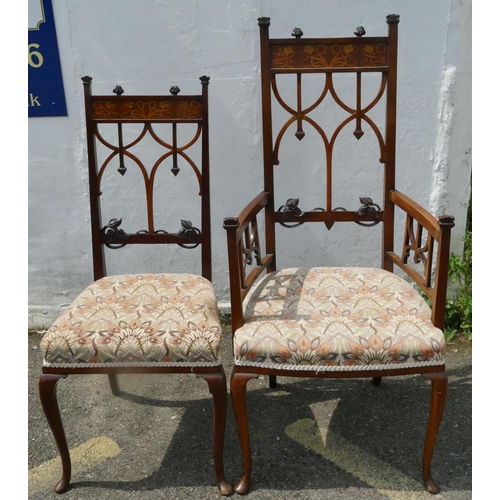 850 - An Edwardian mahogany Arts and Crafts style carving chair with inlaid floral and scroll decoration, ... 