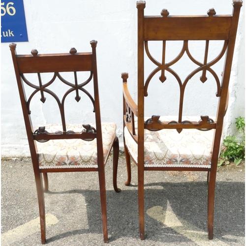 850 - An Edwardian mahogany Arts and Crafts style carving chair with inlaid floral and scroll decoration, ... 