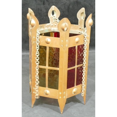 734 - An Arts and Crafts copper hexagonal shaped lantern with yellow and red glass panels, 35cm high witho... 