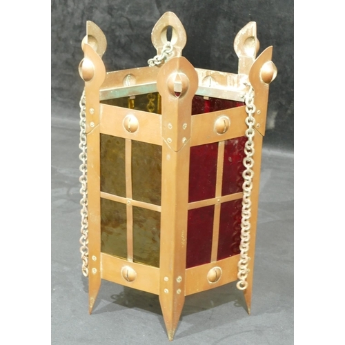 734 - An Arts and Crafts copper hexagonal shaped lantern with yellow and red glass panels, 35cm high witho... 