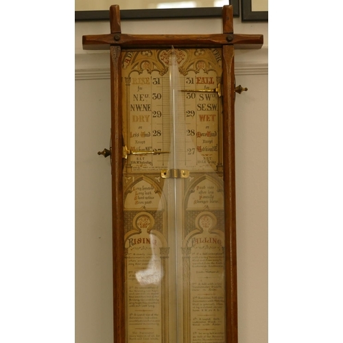 808 - An oak barometer with thermometer, 98cm high, 25cm wide.