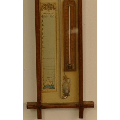 808 - An oak barometer with thermometer, 98cm high, 25cm wide.