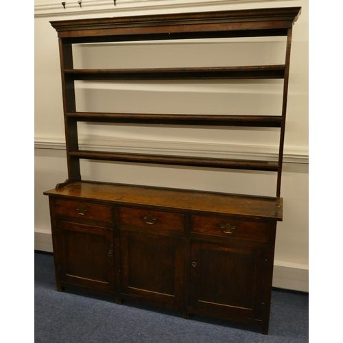 835 - A Georgian oak Welsh dresser with open shelf back, 3 drawers above single panel, flanked by 2 panel ... 