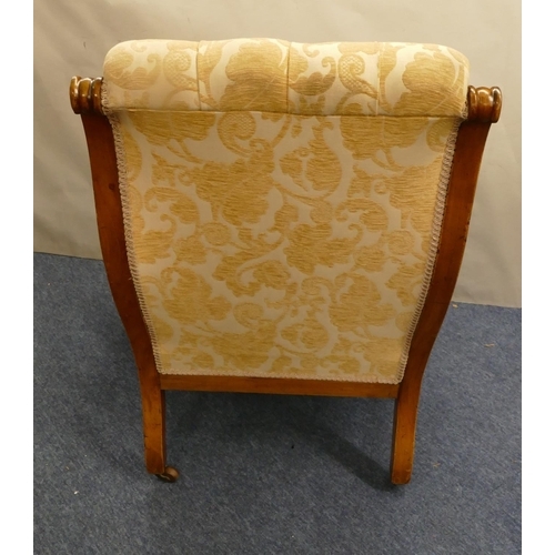 848 - A 19th Century mahogany armchair with cream and yellow floral overstuffed seat, button back and padd... 