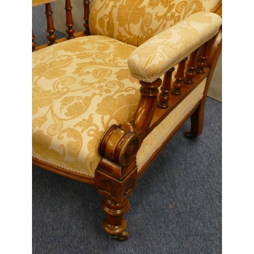 848 - A 19th Century mahogany armchair with cream and yellow floral overstuffed seat, button back and padd... 