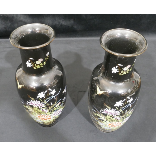 4085 - A pair of Japanese vases on black ground with multi-coloured butterfly and flower decoration, 32cm h... 