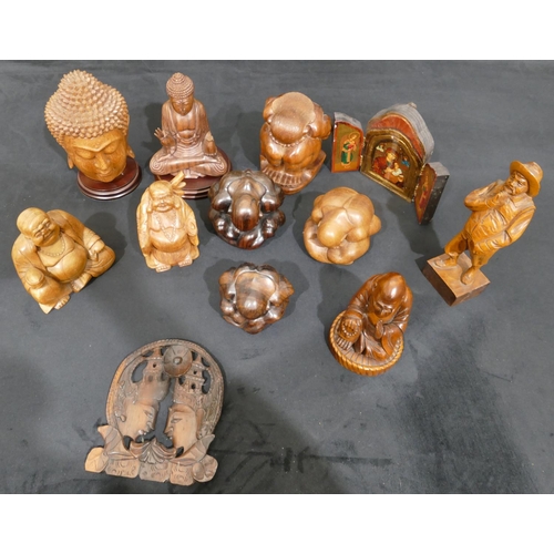 4092 - 11 wood carved figures including Buddha etc and a religious icon. (12)