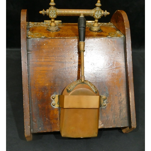 4104 - A Victorian oak coal scuttle with brass mounts.33cm high, 32.5cm wide, 50.5cm deep.