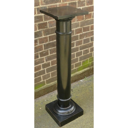 4115 - A black ebonised round bulbous shaped torchere with square top.