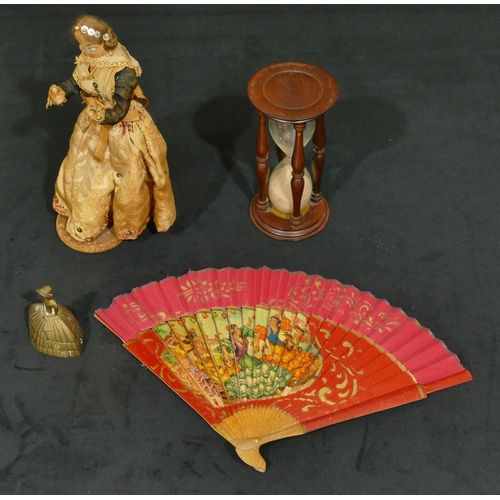 4139 - A Mahogany egg timer, 16cm high, a Continental doll, a brass bell in the form of a lady and a fan (4... 